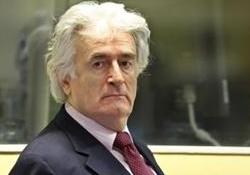 <DIV class=newsDetailTitle>Karadzic attends trial, calls for delay</DIV>